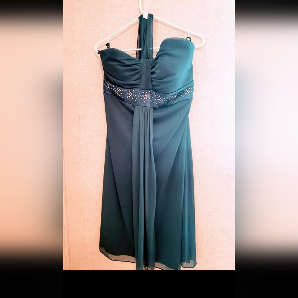 Teal halter dress with silver embellishments. Size 18. Never worn.